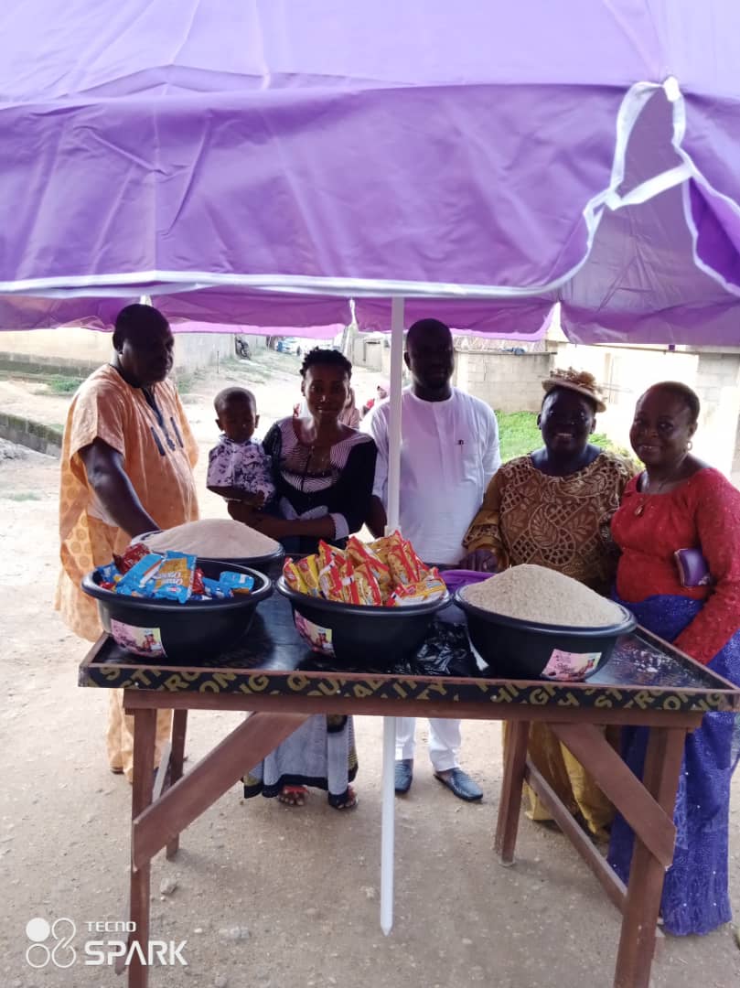 Women proudly showing their products at a market